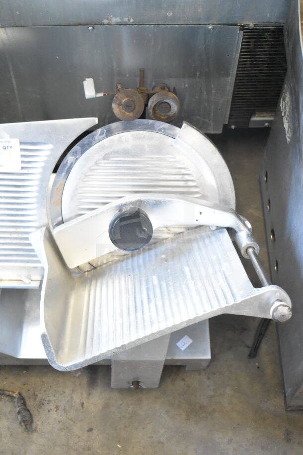 Fleetwood BF 300 commercial countertop meat slicer with blade sharpener, 115V, 1 phase, showing visible wear.