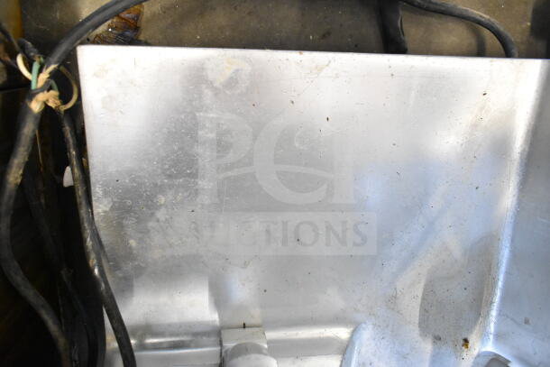 Fleetwood BF 300 commercial meat slicer, includes blade sharpener. Visible wear, operates at 115 volts, 1 phase.