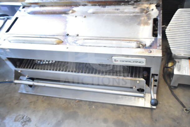 Garland Commercial Countertop Gas Cheese Melter, stainless steel, visible wear, Garland logo on front, adjustable controls.