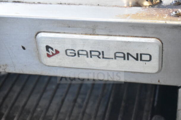 Garland Commercial Countertop Gas Cheese Melter, stainless steel, visible wear, Garland logo on front panel.