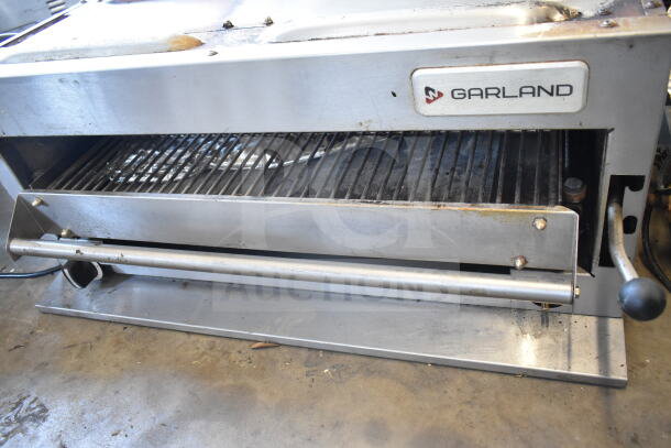 Garland Commercial Countertop Gas Cheese Melter, stainless steel, used condition, visible wear, Garland logo displayed.