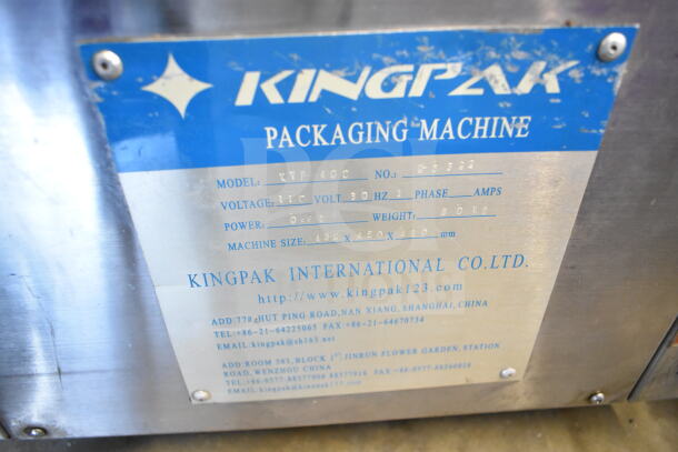 Kingpak KVP 400 Commercial Countertop Vacuum Sealer label, showing model and voltage details.