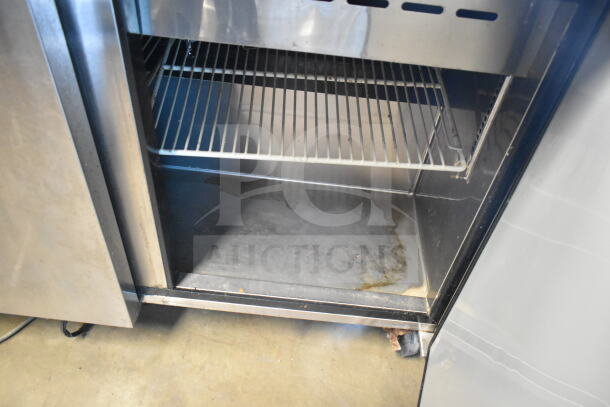 Turbo Air MST-72-30 prep table interior, stainless steel shelves, visible wear and stains, 115V, 1 phase.