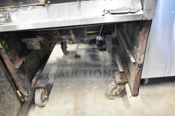 BKI FKM-F commercial fryer; electric, floor style, 208V, 3-phase, visible label, worn exterior and wheels.