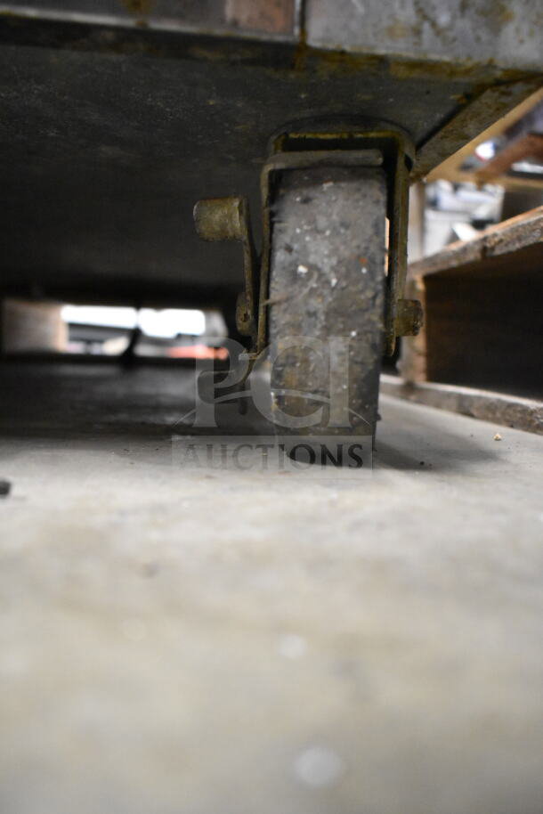 2019 Continental 1RNGD Commercial Single Door Cooler with visible caster, showing signs of wear. 115 Volts, 1 Phase.
