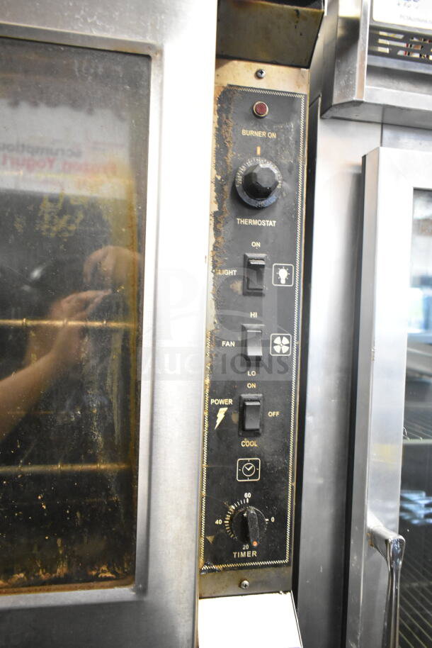 Royal full-sized convection oven with view-through and solid doors, thermostatic controls, used condition.