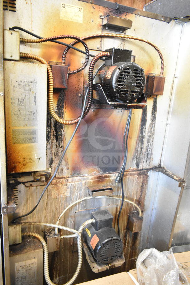 Royal commercial convection oven interior, showing wiring and fan motors. Visible wear and discoloration.