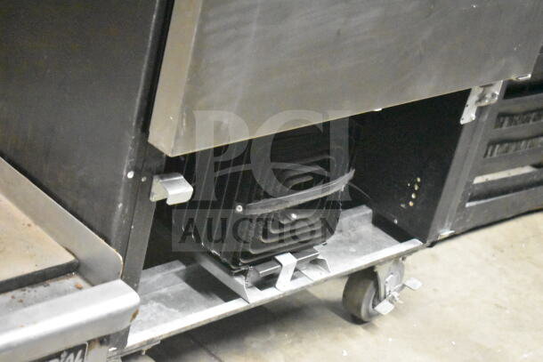 Beverage Air SR1HC-1S commercial cooler on casters, visible compressor, 120V, 1 phase, sturdy condition.