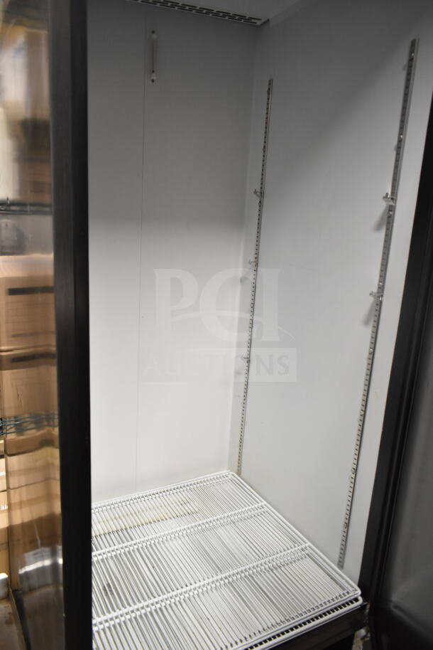 Beverage Air SR1HC-1S reach-in cooler, single door, on casters, 120V, inside view. Clean, spacious interior with adjustable shelving.