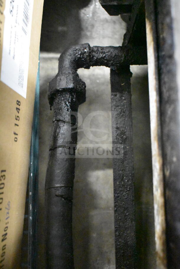Imperial Commercial Countertop Gas Griddle, showing a close-up of the gas pipe with signs of use.