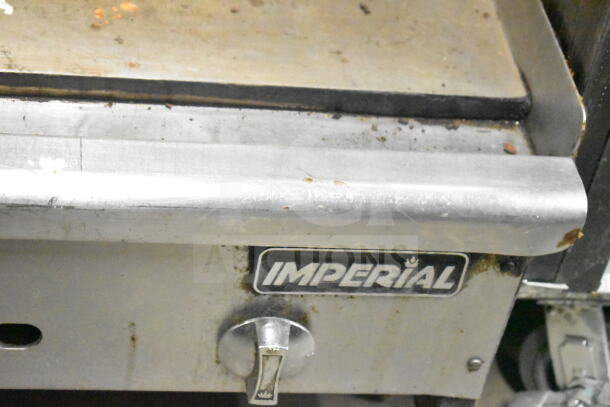 Industrial Imperial countertop gas griddle, showing wear. Features control knob and branded label. Ideal for commercial use.