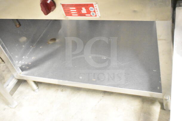 L&T SLT Commercial Steam Table, natural gas powered, stainless steel, with control knob and red label, in used condition.