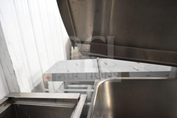 Groen commercial floor-style braising skillet, stainless steel, used, open lid, with visible sturdy construction and commercial-grade design.