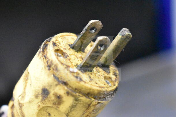 Traulsen Commercial Chef Base power plug, showing wear and rust, 115 volts, 1 phase, essential kitchen equipment.