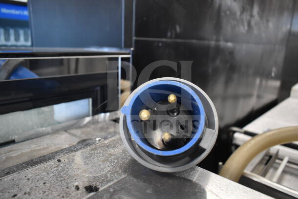 Belshaw TG50 Commercial Thermoglazing Station plug, 208 volts, 1 phase, shown on a metallic surface, with visible prongs.