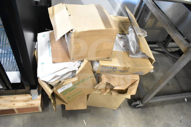 Stack of various items in open boxes including F21824 seal top bags and RP-5000 half fold seat covers. Mixed condition.