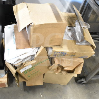Stack of various items in open boxes including F21824 seal top bags and RP-5000 half fold seat covers. Mixed condition.