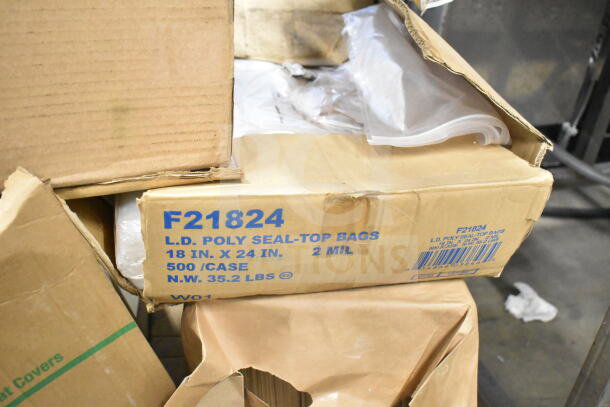 Box of F21824 LD poly seal-top bags, 18x24 in., 2 mil, 500/case. Visible signs of wear on packaging.