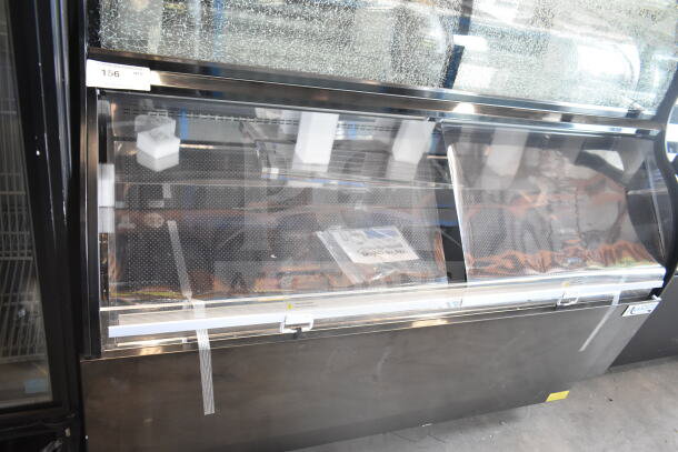 Avantco 193CAC60B black refrigerated air curtain merchandiser, 59 1/8", dual service, visible broken glass, 115V, 1 Phase.