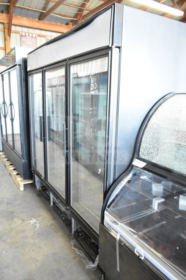True GDM-72F-LD commercial 3-door reach-in freezer, glass doors, 115/208-240V, 1 phase, in good condition.