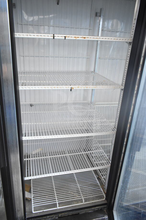 True GDM-72F-LD commercial freezer, 3-door reach-in, with wire shelves, 115/208-240 volts, clean condition.