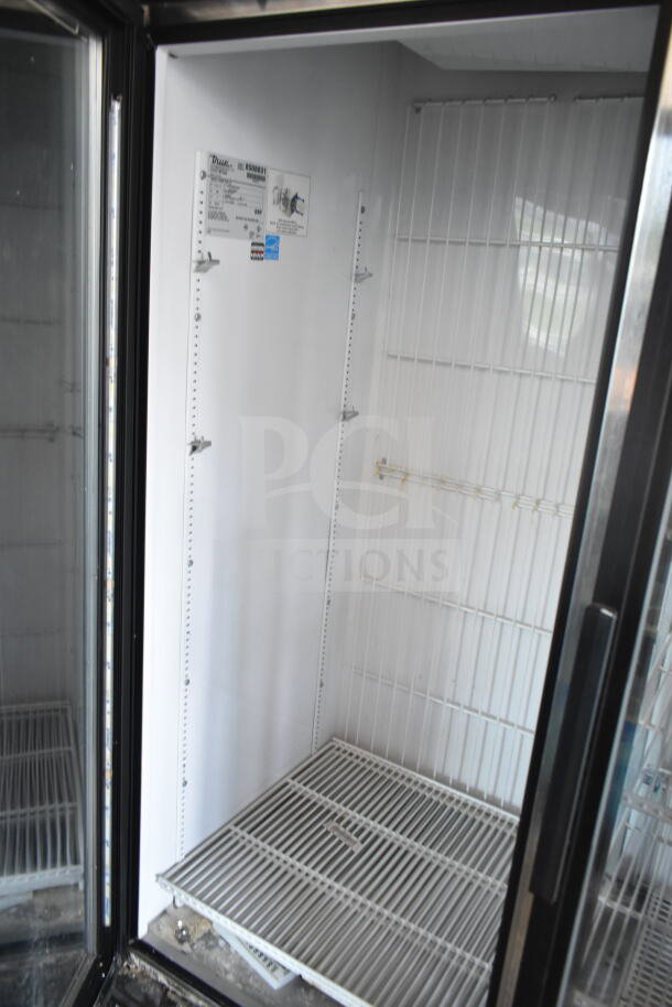True GDM-72F-LD commercial 3-door freezer; 115/208-240 volts; interior view; shelving and label visible; used condition.