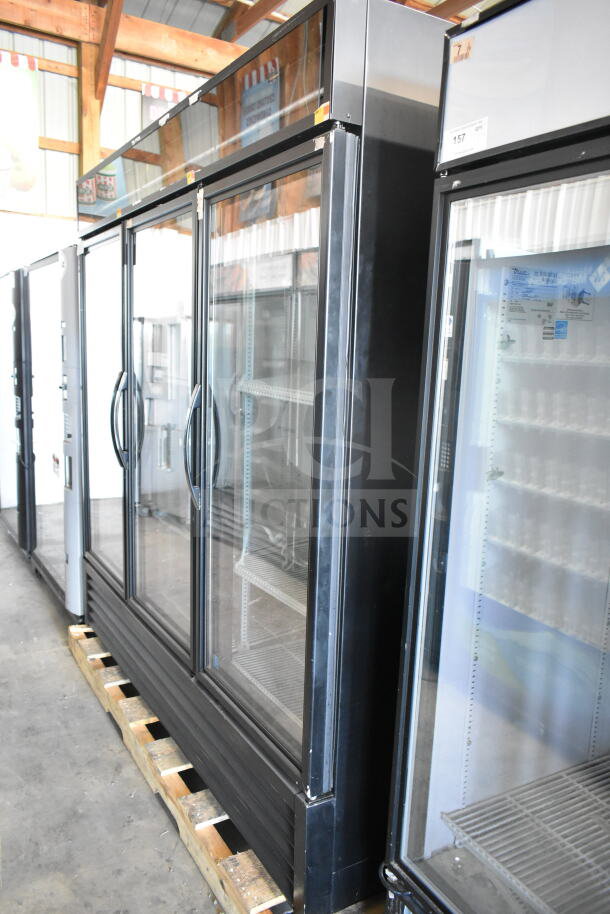 2016 True GDM-72-LD 3-door commercial cooler. Black finish, glass doors, shelves visible inside. 115V, 1 Phase.