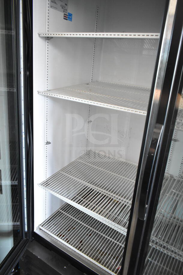 2016 True GDM-72-LD commercial 3-door cooler merchandiser, white shelves, 115 volts, 1 phase, good condition.