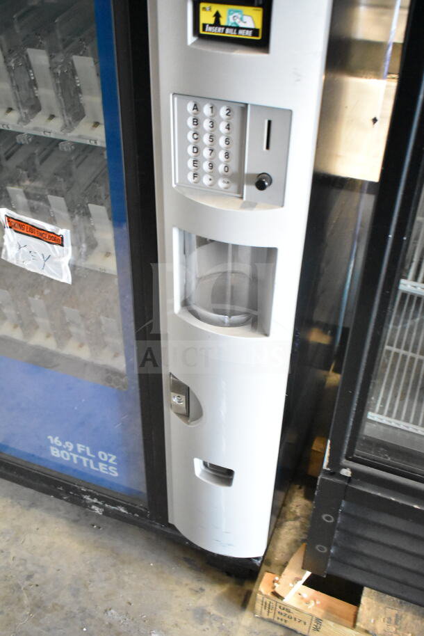 Crane 5800-4 commercial vending machine, accepts bills, 115V, 1 phase, keypad, and visible slots for 16.9 fl oz bottles.