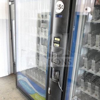 Crane 5800-4 commercial vending machine with bill acceptor, 115V, 1 phase. Features 25¢ branding and asset ID tag.