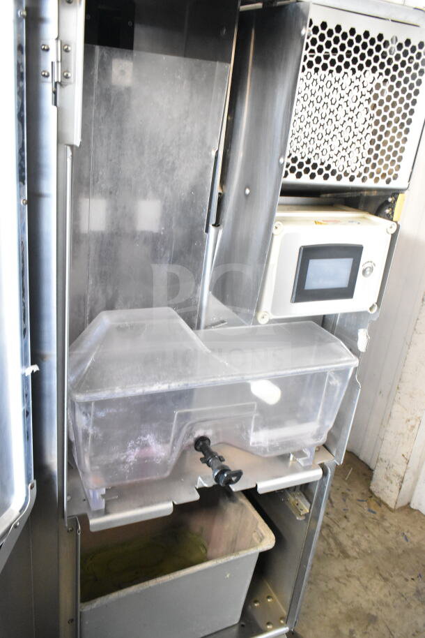 JBT 2ND-GEN-MFJ-HE commercial citrus juicer on casters, 115V, 1 phase, stainless steel body with digital controls, used condition.