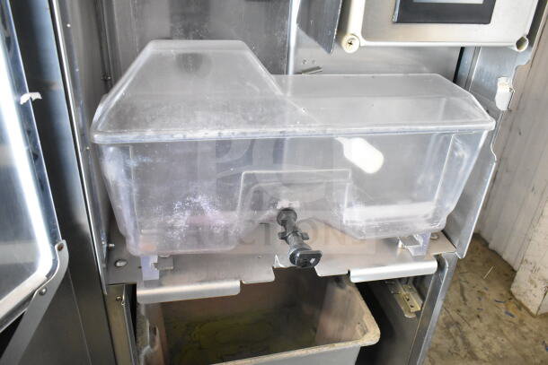 JBT 2ND-GEN-MFJ-HE commercial citrus juicer, features clear juicing container, floor model on casters, 115V, 1 phase.