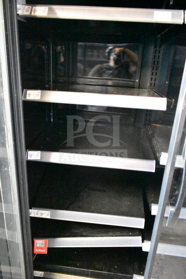 2021 True TVM-48SL-HC commercial cooler, 2-door, shelves labeled with prices, 115V, 1 phase, clean interior.