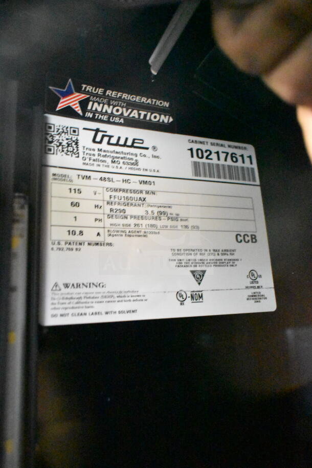 2021 True TVM-48SL-HC commercial cooler label showing model, voltage, and refrigerant details. Model: TVM-48SL-HC, 115V.