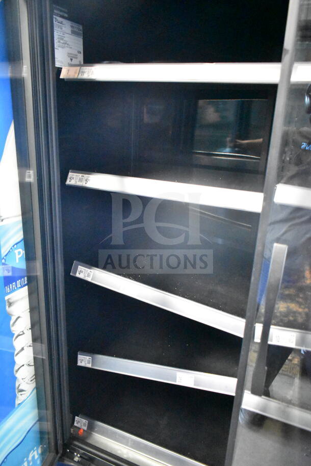 2021 True TVM-48SL-HC Commercial 2 Door Cooler, black interior, multiple metal shelves, 115V, ideal for merchandising.
