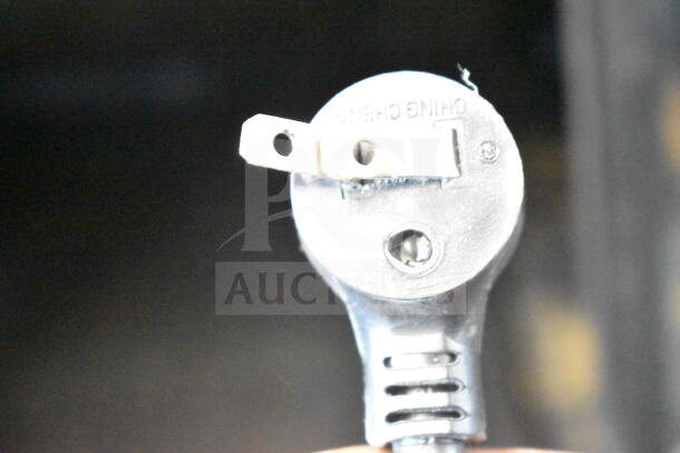 Close-up of a plug from the 2021 True TVM-48SL-HC Commercial 2 Door Reach In Cooler Merchandiser, 115 Volts, 1 Phase.