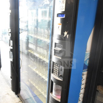 Crane 5800-4 commercial vending machine, includes bill acceptor. Visible signs of use, 115 volts, 1 phase, asset ID shown.