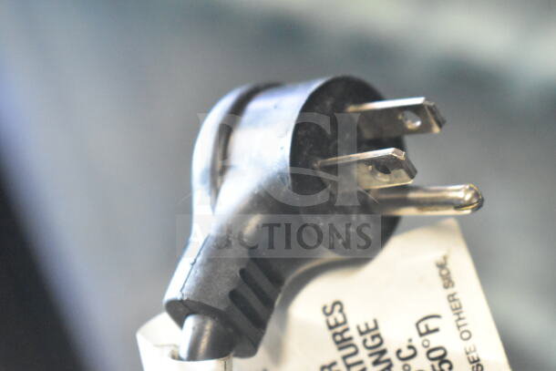 Black power plug for a Crane 5800-4 vending machine, showing prongs and a partial label.