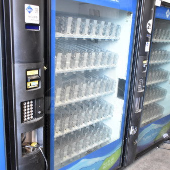 Crane 5800-4 commercial drink vending machine with bill acceptor, front view. Features coin slot, keypad. Model: 5800-4.