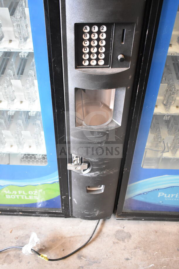 Crane 5800-4 vending machine with keypad, bill acceptor, and bottle compartments. 115V, 1 Phase. Good condition.