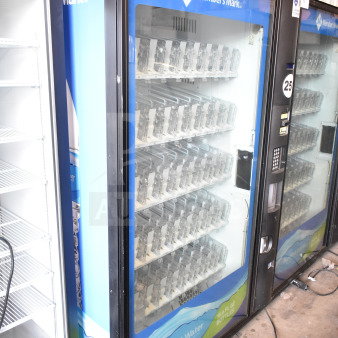 Crane 5800-4 commercial drink vending machine with bill acceptor. Visible Member's Mark branding. Condition appears used.