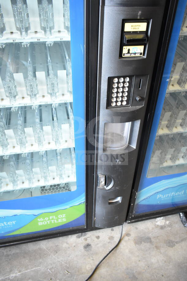 Crane 5800-4 vending machine, 115V, 1 Phase, with bill acceptor, keypad, and visible slots. Good condition.