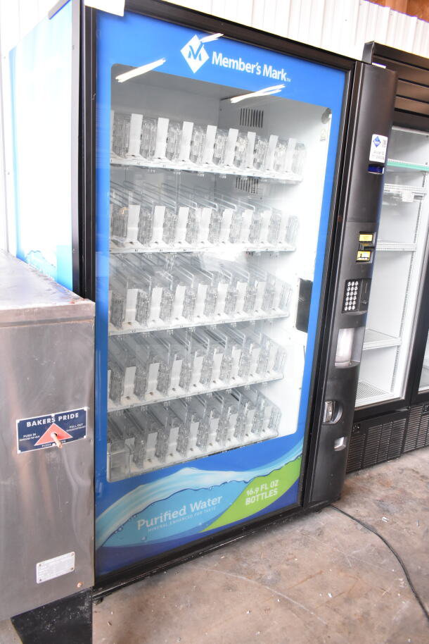 Crane 5800-4 vending machine, bill acceptor, glass front, shelves for bottled drinks, 115 volts, 1 phase.