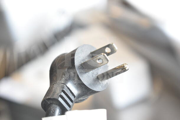 Plug detail of Crane 5800-4 Vending Machine, 115 Volts, 1 Phase, shows bill acceptor.