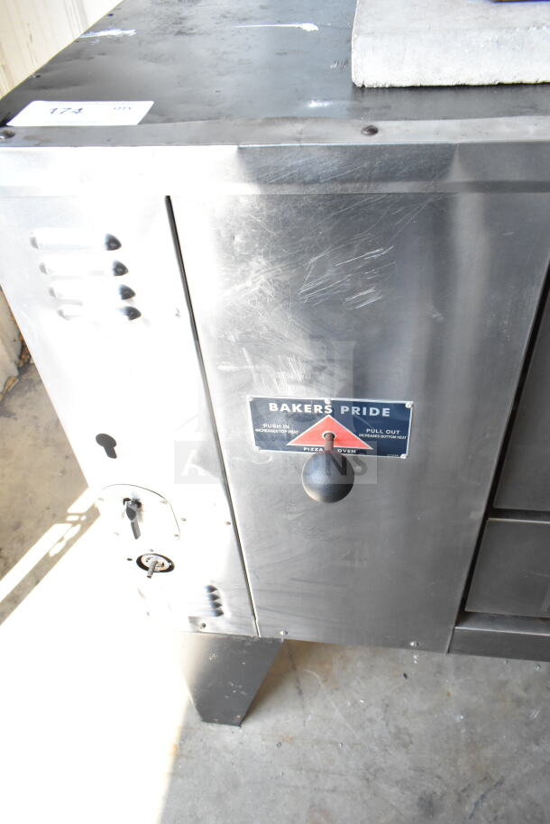Bakers Pride D125 Commercial Pizza Oven, natural gas, 125,000 BTU, on metal legs, used condition, visible brand plate.