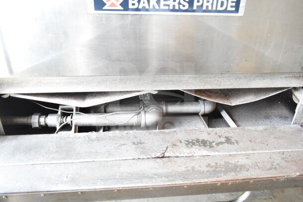 Bakers Pride D125 commercial single deck pizza oven, natural gas-powered, 125,000 BTU. Visible wear, mounted on metal legs.