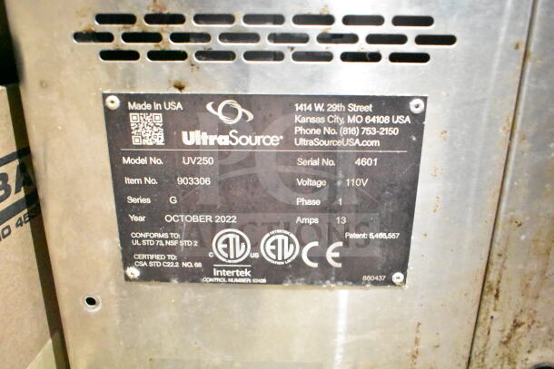UltraVac UV250 Vacuum Sealer label showing model, voltage (110V), phase (1), series G, serial number 4601, made in USA.