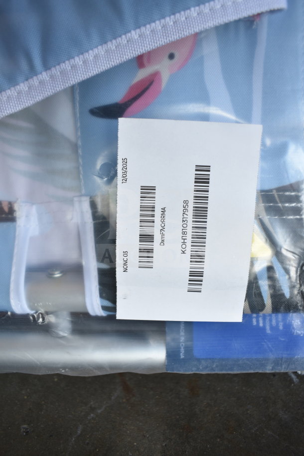 Beach chair packaged with visible product label featuring barcode and date, 12/03/2025, partially showing colorful design.