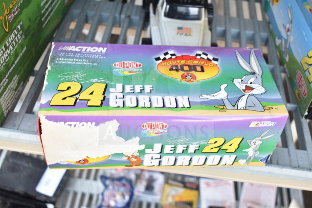Box for DuPont 24 Jeff Gordon stock car model with Bugs Bunny graphic, featuring Monte Carlo 400 branding. Visible wear on the box.