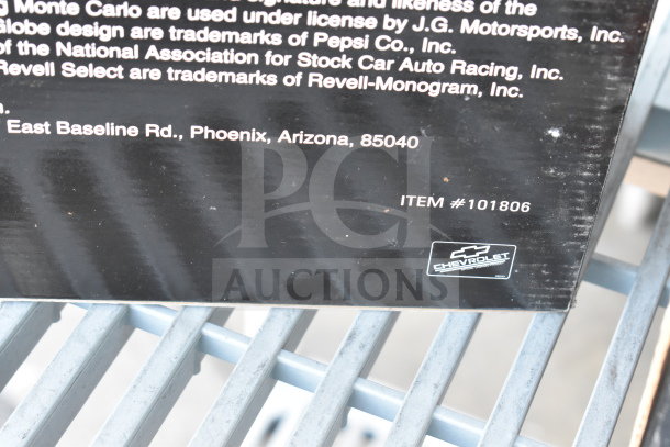 "Item #101806 label on a black box for 5 vintage toy models, including Texaco trucks and Mickey Mouse train set."